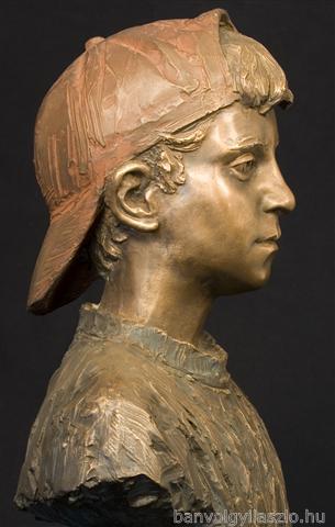 Boy in red cap bronze portrait